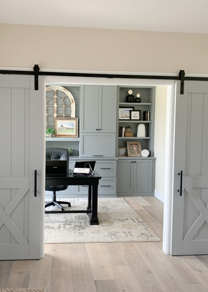 Barn doors painted gray blue green blend Magnolia Day to Day, office built in cabinets painted Teak Cups Magnolia. Whitewash oak wood floor. Kylie M Interiors Edesign CLIENT PHOTO