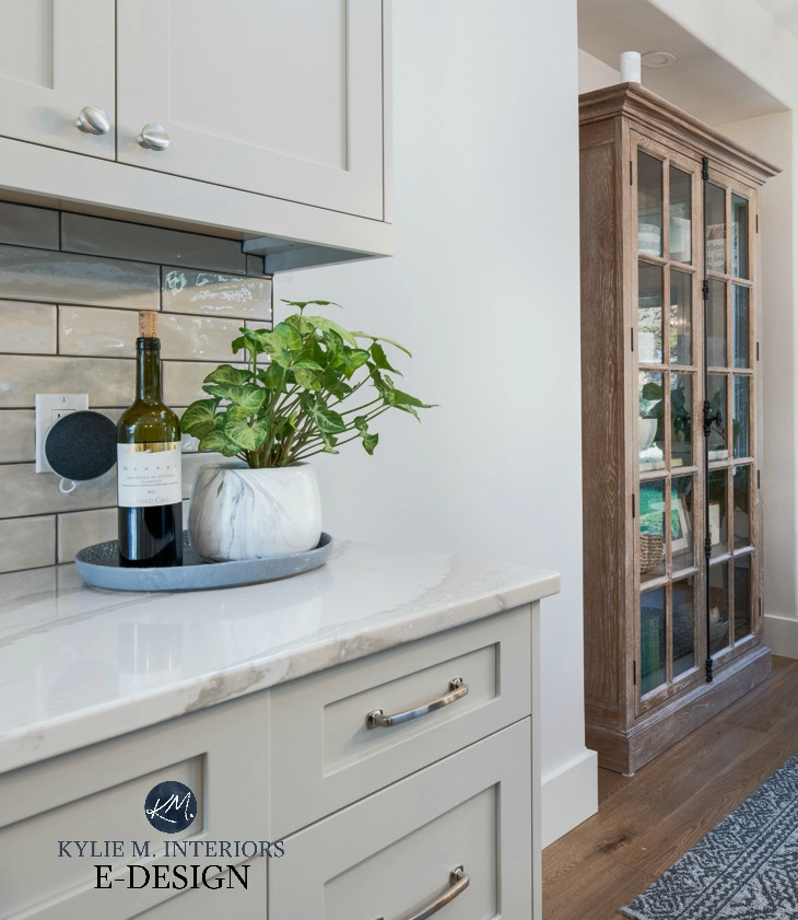 Dining room with modern farmhouse style furniture, Brittanica Warm Cambria quartz countertop, Revere Pewter warm gray cabinets. Kylie M Interiors Edesign, online paint color consulting (1)