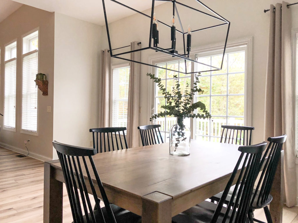 Dining room with transitional farmhouse modern style home decor. Sherwin Williams Alabaster, best warm white paint color on walls. Kylie M Interiors Edesign, client photo