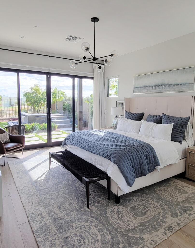 Dunn Edwards Faded Gray similar to Benjamin Moore Silver Satin, off white warm gray, primary bedroom, home staging ideas, blue accents, rug on wood