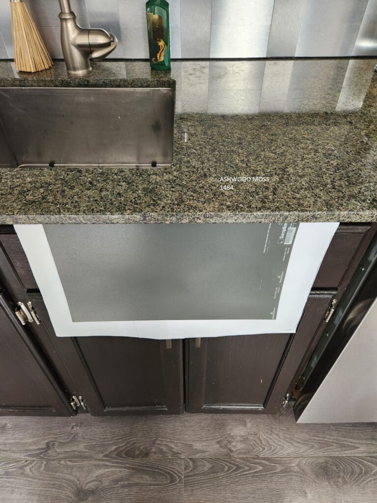 Green toned granite countertops with Benjamin Moore AShwood Moss Samplize peel and stick sample, violet gray toned laminate floor. how to pick a paint color with Kylie M