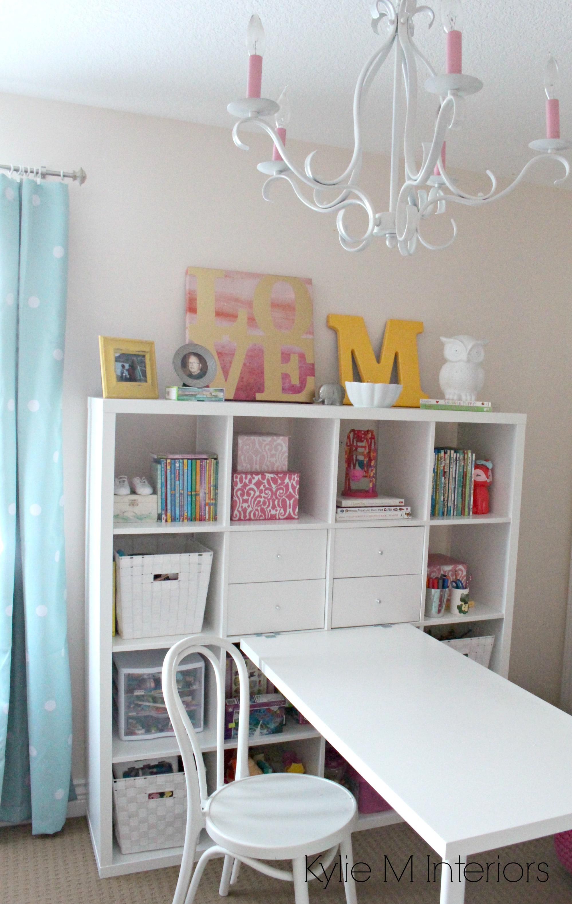 little girls bedroom in Benjamin Moore Pink Bliss with gold, yellow and blue accents. Great craft, desk area with the ikea kallax or expedit unit