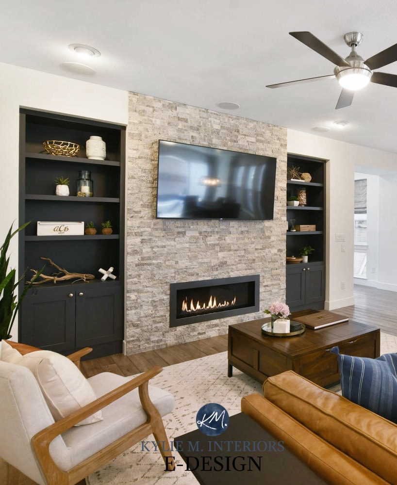 Living room, stacked stone fireplace, tv, builtins painted Benjamin Cheating Heart, Pure White walls,cognac leather. Kylie M Interiors Edesign, online paint color consultant