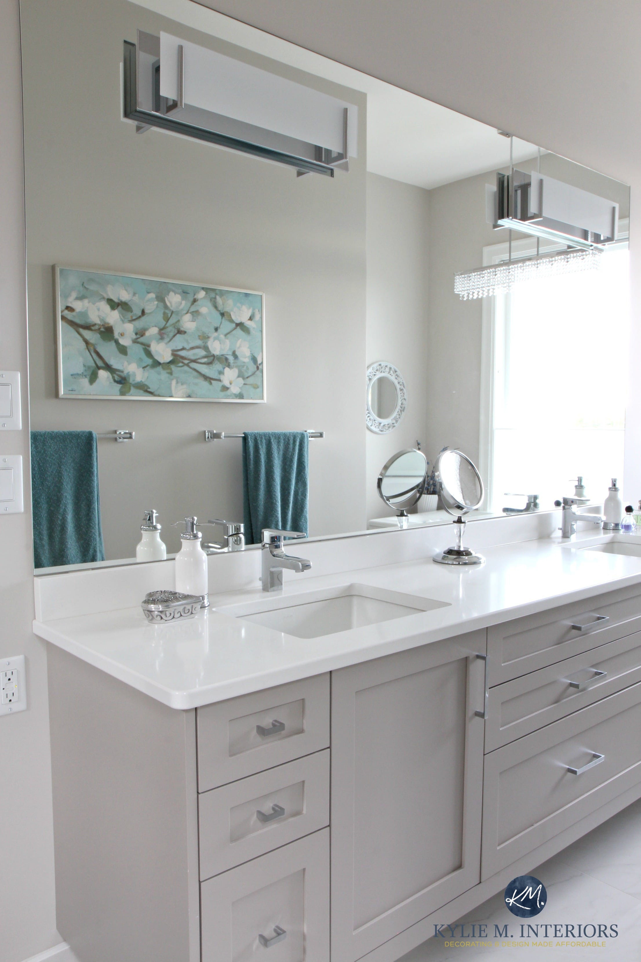 Master bathroom with double vanity painted gray. Cambria Quartz countertop in Kirkstead. Chrome metal accents, Benjamin Moore Balboa mist paint colour. Kylie M Interiors Decorating and D