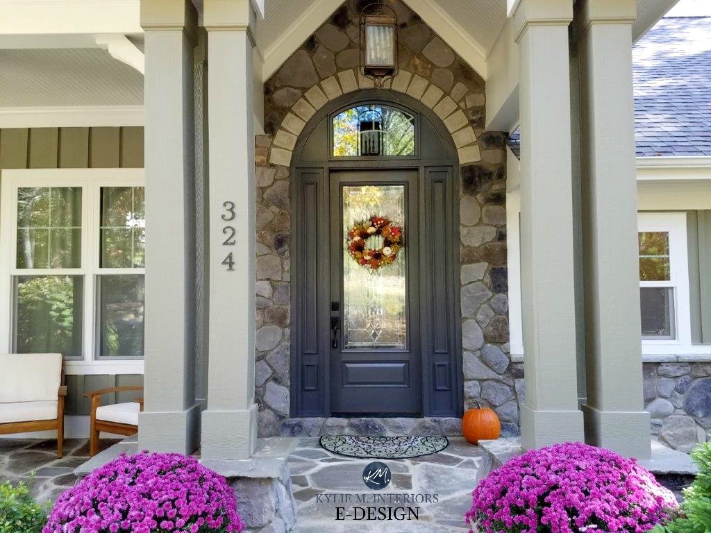Stone exterior around front door with patio and beams. Kylie M Interiors Edesign, online paint color consultant. DIY Decorating and design. Front door painted Benjamin Moore Gray 2121-10