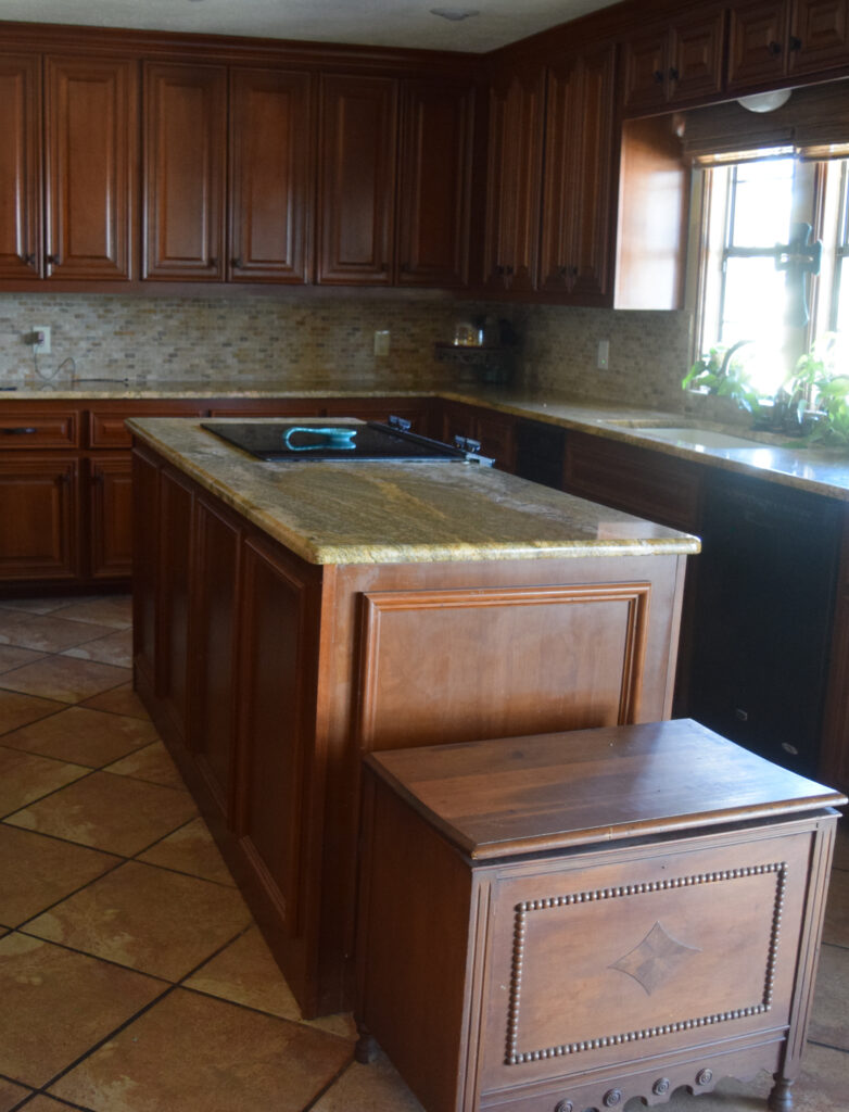BEFORE kitchen with wood cherry or maple cabinets before painting. tile floor, granite countertops, travertine (2)