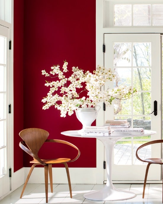 Benjamin Moore Caliente colour of the year in eating area with white tile via BM. Info via Kylie M E-design, expert advice