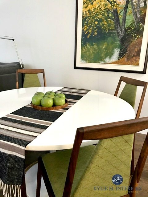 Benjamin Moore Silver Satin with green accents in a mid century modern dining room with furniture and decor. Kylie M INteriors E-design