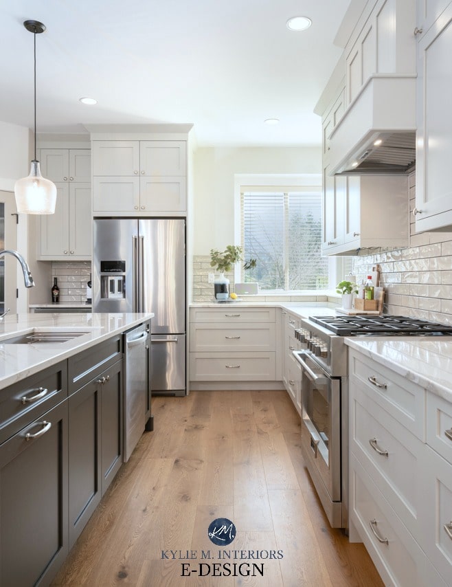 Kitchen with warm gray, Benjamin Moore Revere Pewter cabinets and Sherwin Williams Urbane Bronze painted island. White oak wood flooring. Kylie M Interiors Edesign, blog and colour advice online
