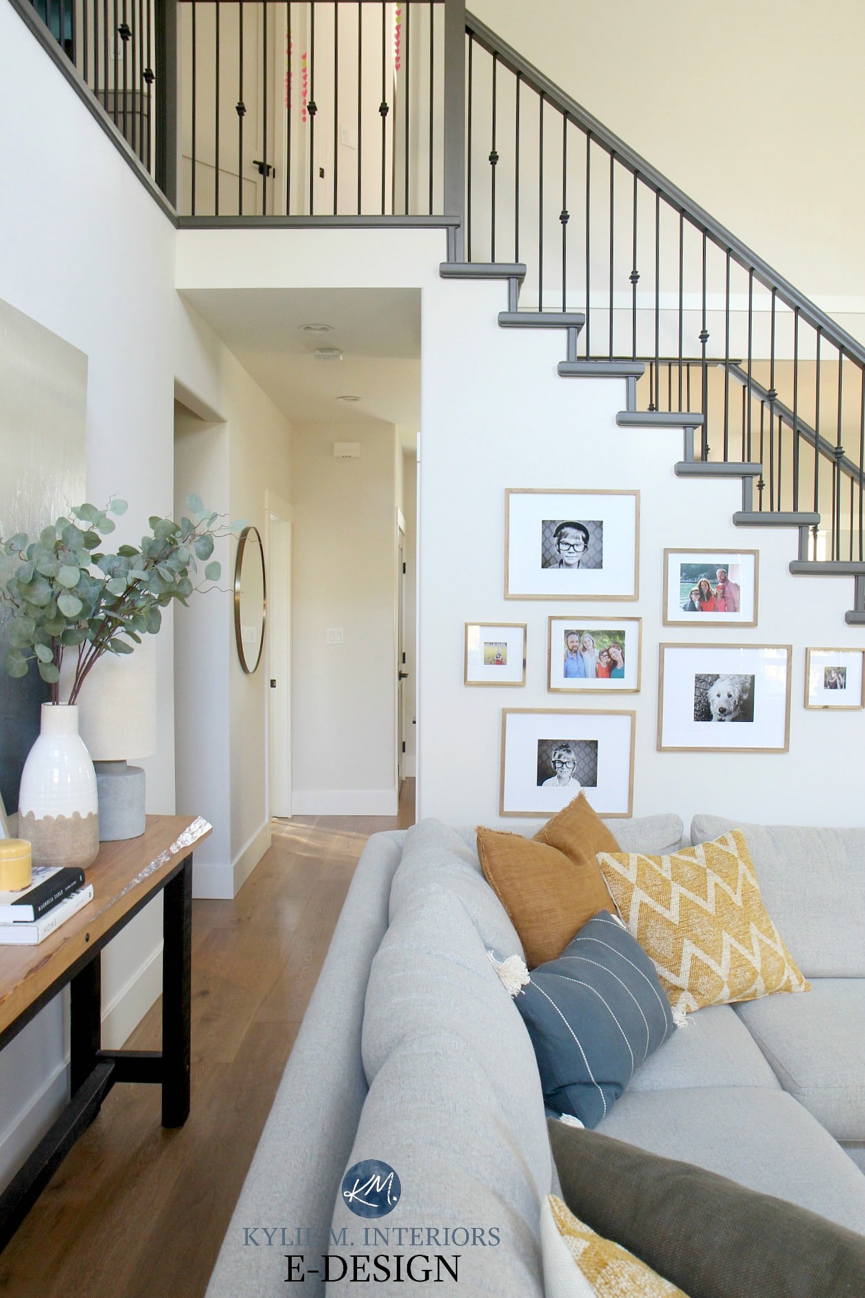 Open layout, livingroom, tall ceiling, vaulted, Benjamin Moore Edgecomb Gray best greige and White Dove. Sherwin Urbane Bronze painted stair railing and open staircase. DIY Decorating and Design ideas