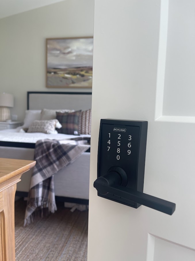 schlage electronic locking door handle on bedroom door. latitude lever