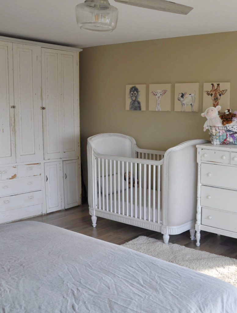 Sherwin Williams Basket Beige warm neutral paint color, rustic cozy nursery in primary bedroom