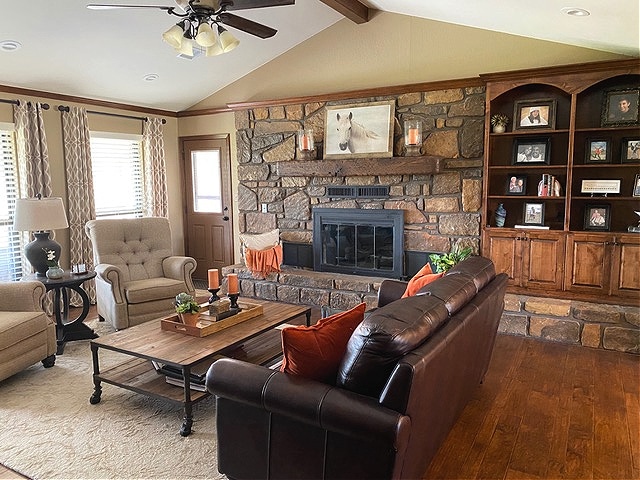 Sherwin Williams Latte, warm stone fireplace, orange accents, leather furniture. Kylie M Interiors BEFORE Edesign