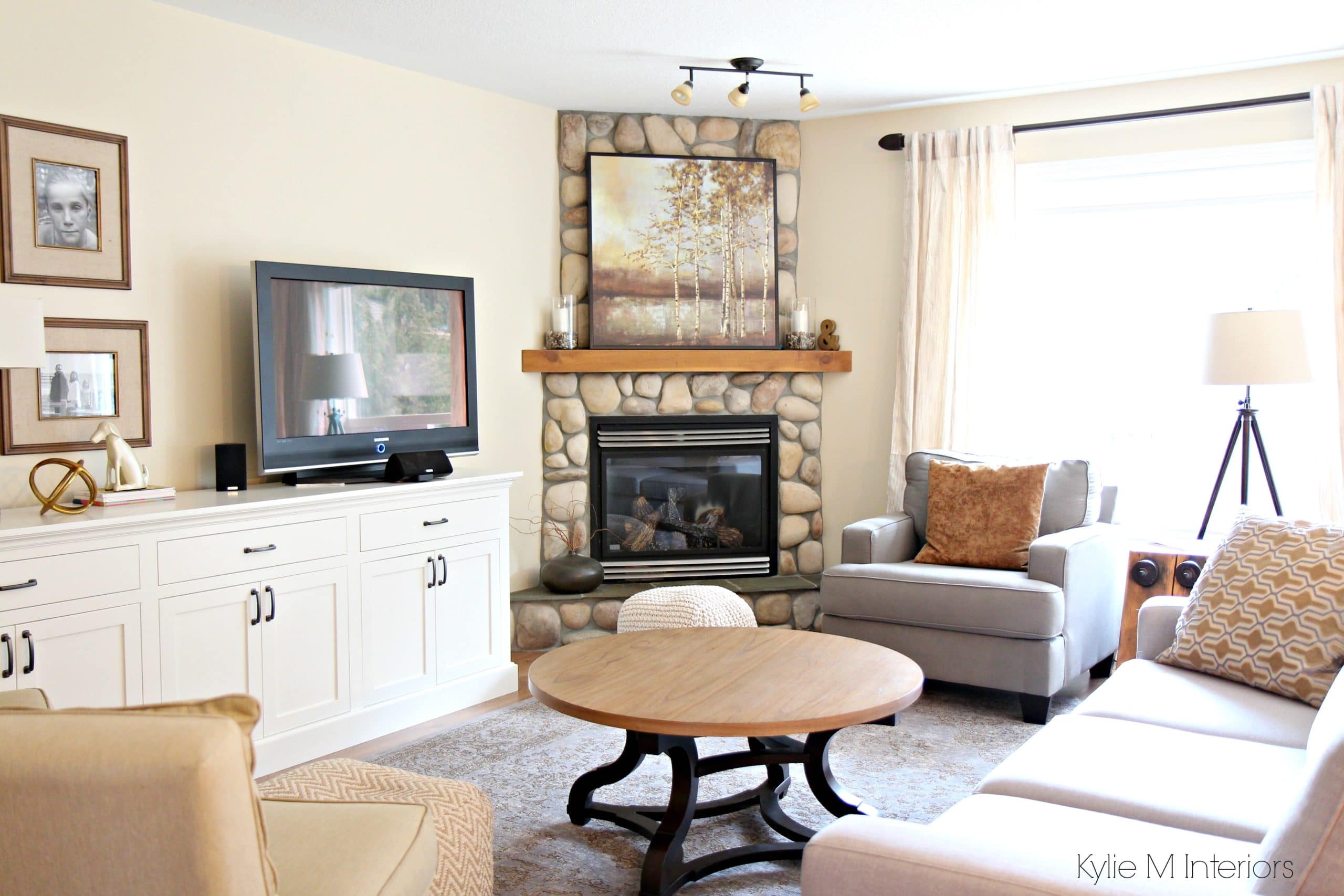 South facing living room with stone corner fireplace, furniture, home decor and custom tv stand